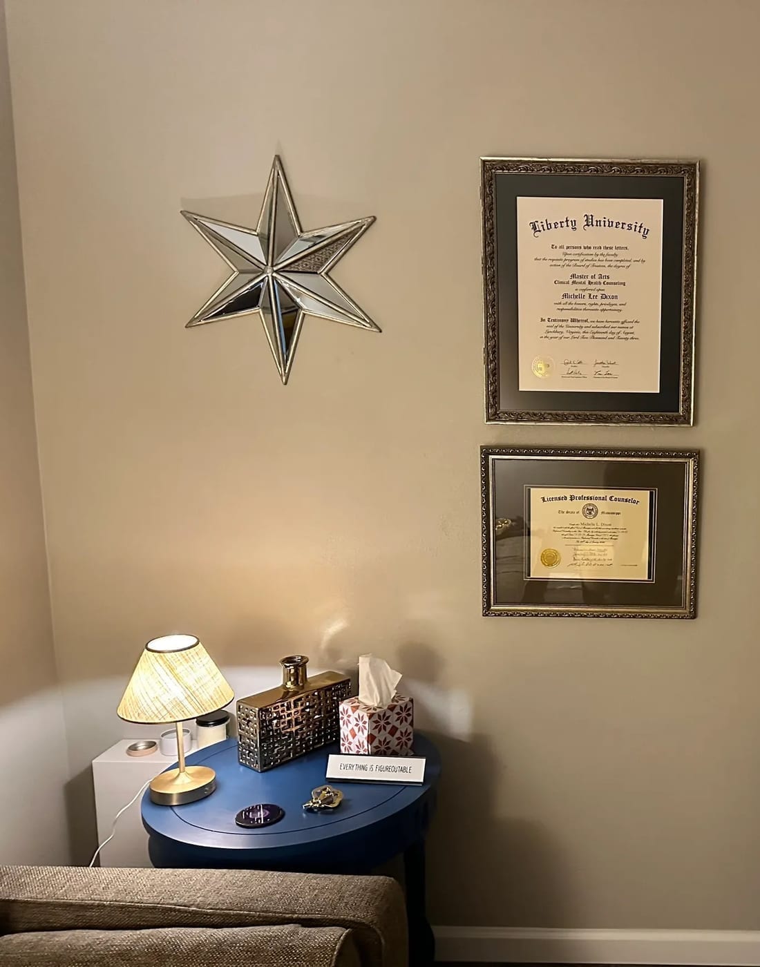 Michelle Dixon's Master of Arts in Clinical Mental Health Counseling from Liberty University and her Mississippi Licensed Professional Counselor license, framed in the office